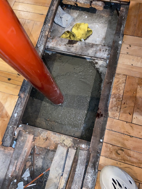 A close-up of a newly installed concrete column