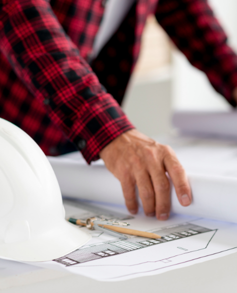 Soundproof Insulation Installation: A Contractor Working at His Desk<br />
