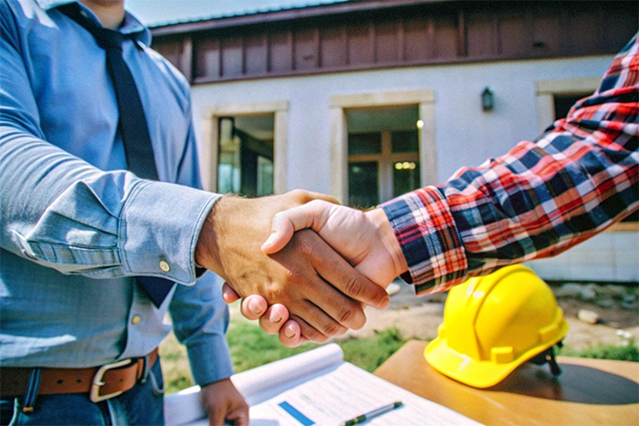 Foundation Repair, Insulation, Mold Remediation, and Waterproofing Contractors in Atlantic Beach, NY - A Contractors and a Homeowner Shaking Hands