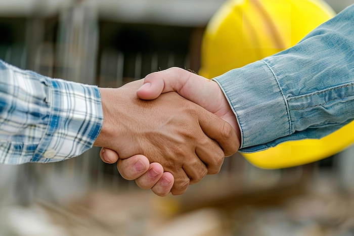 Foundation Repair, Insulation, Mold Remediation, and Waterproofing Contractors in Auburndale, NY - A Homeowner and Contractor Shaking Hands