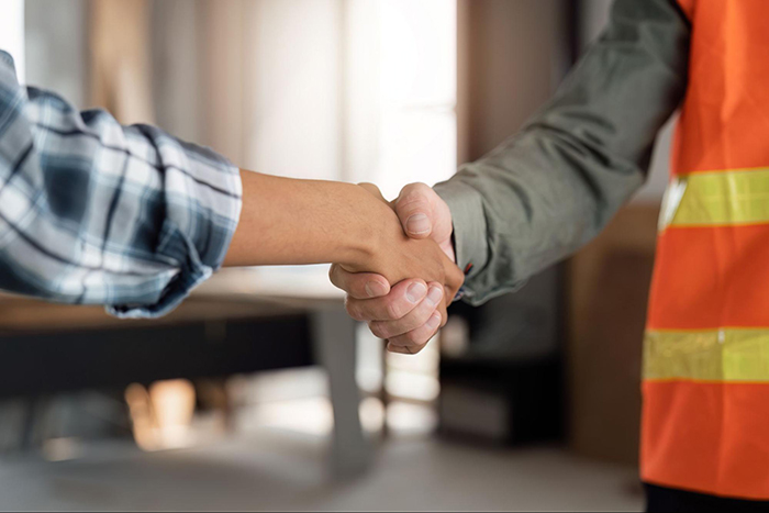 Foundation Repair, Insulation, Mold Remediation, and Waterproofing Contractors in Amityville, NY - A Contractor and a Homeowner Shaking Hands