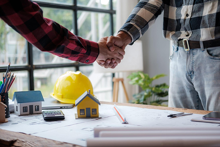 Foundation Repair, Insulation, Mold Remediation, and Waterproofing Contractors in Aquebogue, NY - A Business Owner and Contractor Shaking Hands