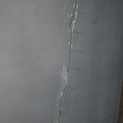 A large vertical crack in the foundation Before