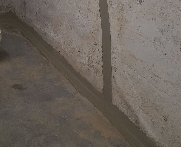 A waterproofed wall-joint area in the basement of a property in Hicksville, NY.