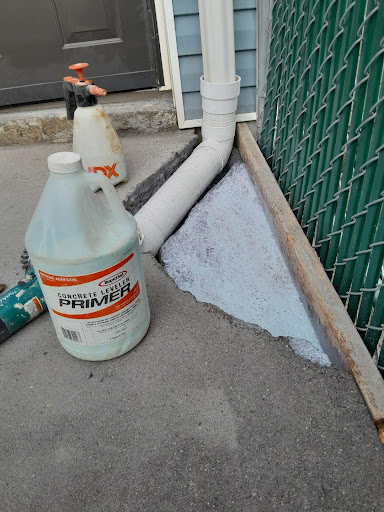 A gutter downspout being repaired 