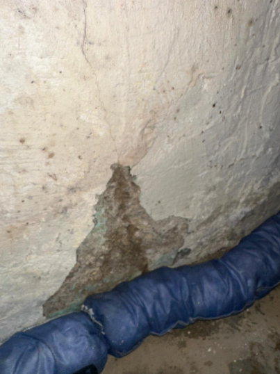 A large structural crack in the garage wall 