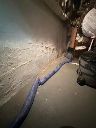 The garage wall after repair work with repaired structural cracks