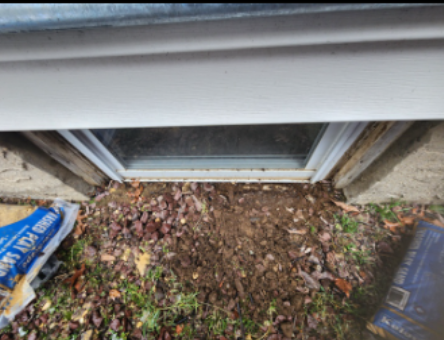  A before picture of the old leaking window well in the Commack home that needed replacement 
