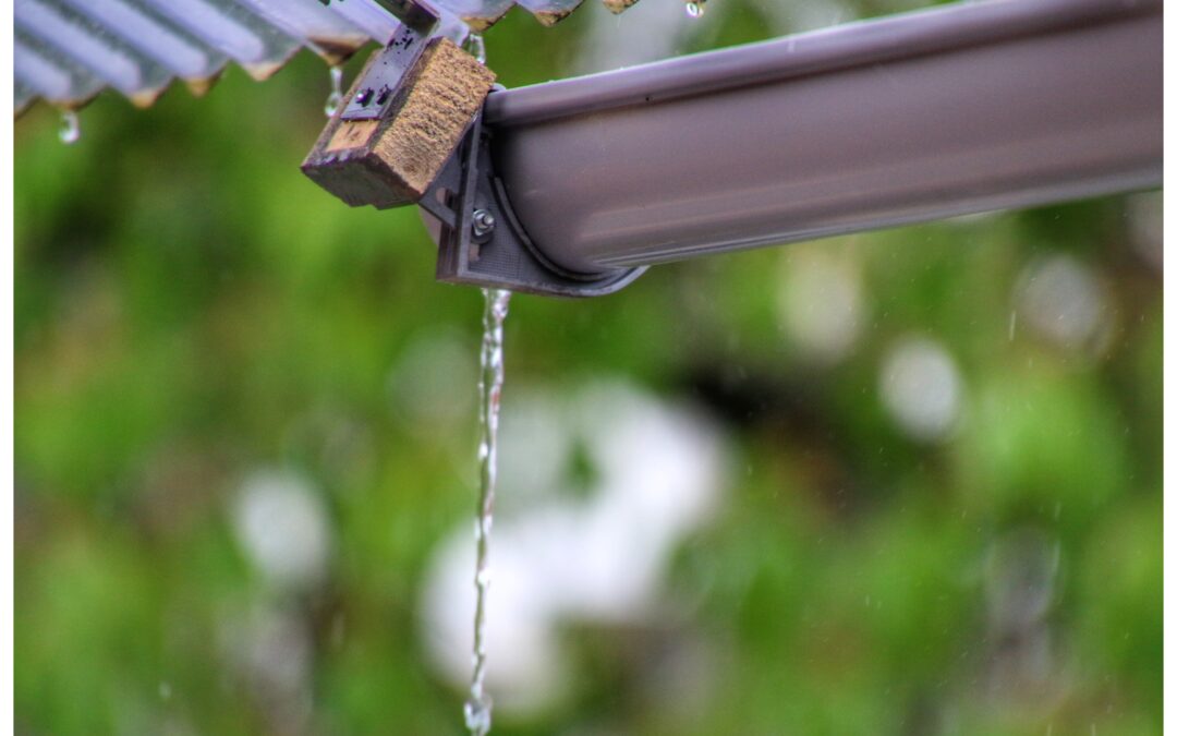 Gutters and downspouts - A zoomed image of a black leaking gutter