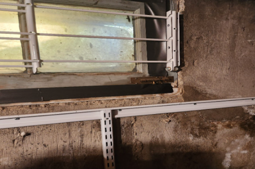 A close-up of water penetration in the foundation wall of the basement.