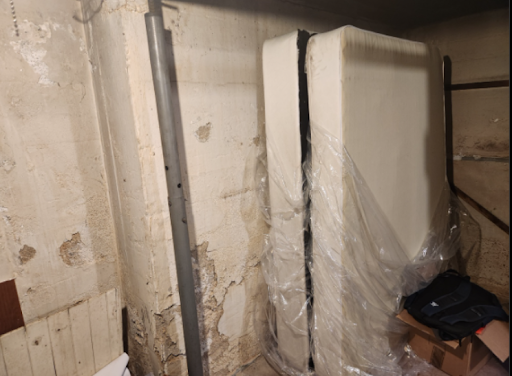 The situation of the basement walls in Rockville Center, NY before restoration and repair by the Zavza Seal Team.