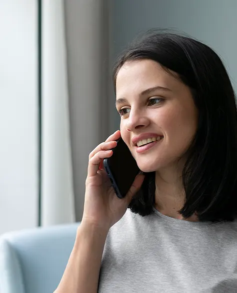 A young woman calling on her cell phone 