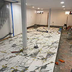 Tiled and repaired floor in the basement