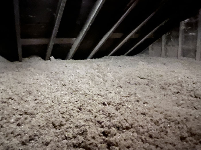 Cellulose insulation after being installed by the Zavza Seal LLC team