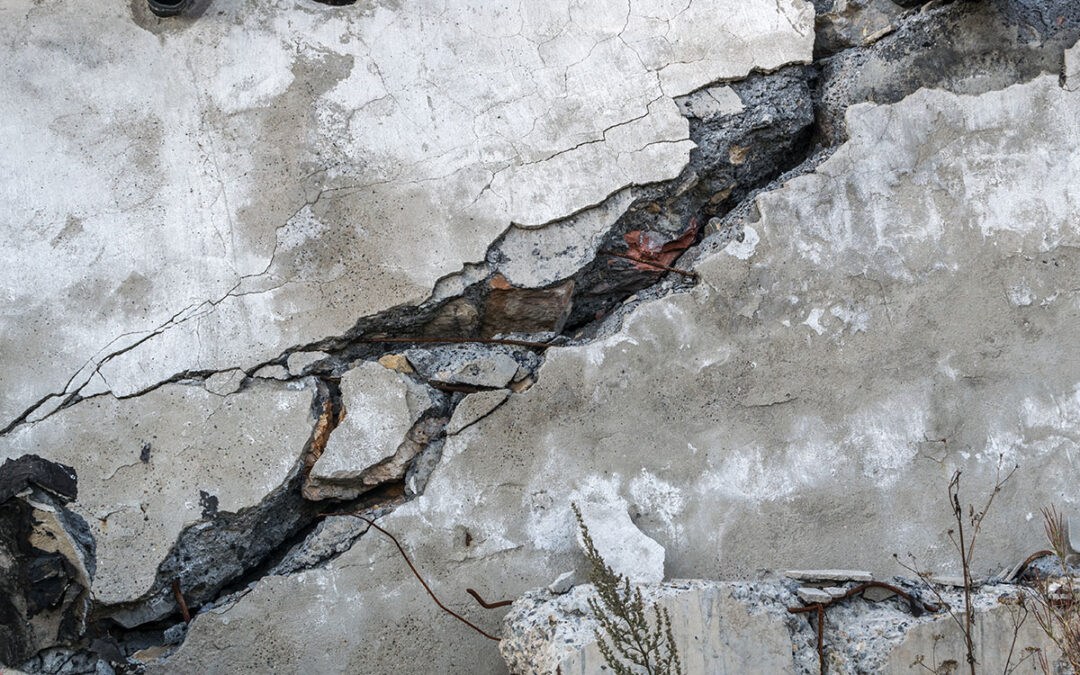 Cracks in the basement floor made up of concrete.