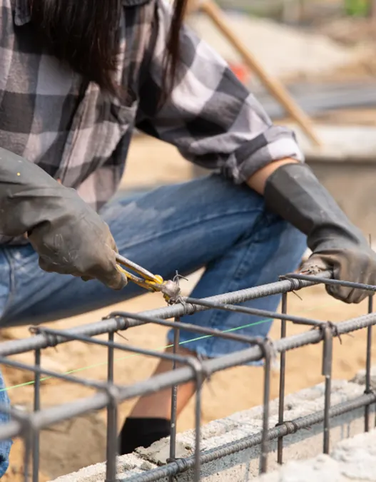 Footing Installation: A contractor laying the footing at a construction site