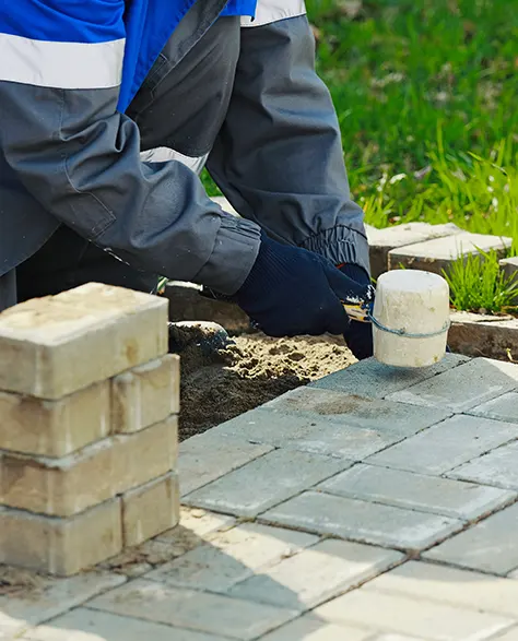 Image of a Contractor Installing Patio Pavers