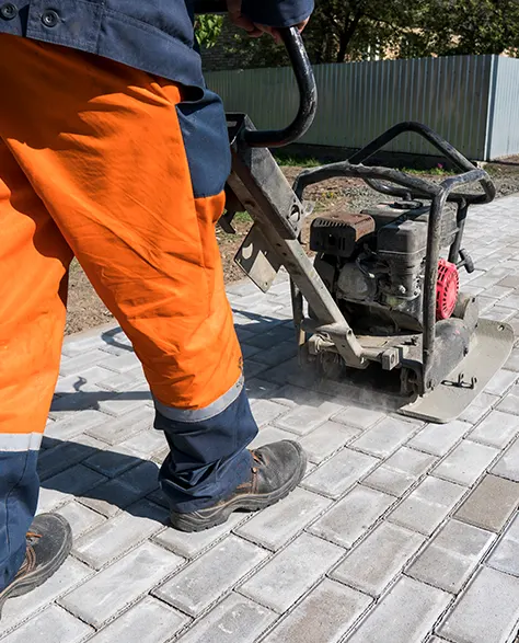 Image of a Contractor Installing Walkway Pavers