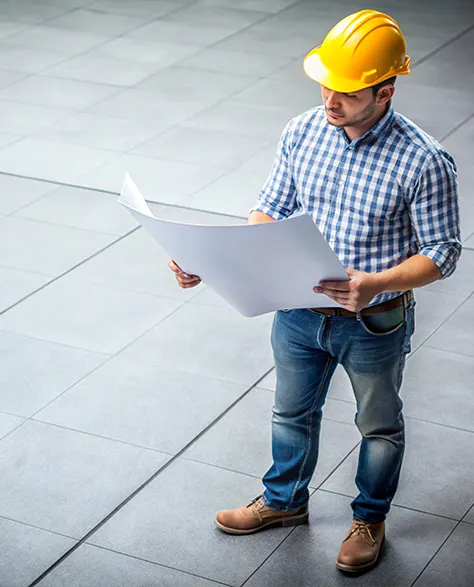 Image of Contractor Holding a Blueprint for Walkway Paver Design