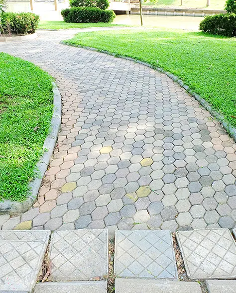 Image of Walkway Pavers Installed Alongside a Beautiful Garden