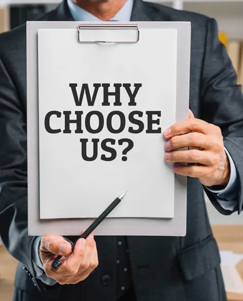 A man in a tie holding a clipboard with the words, “Why Choose Us”