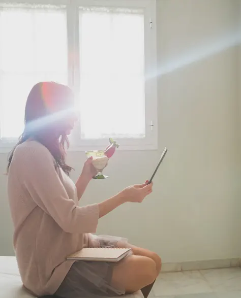 Sunlight streaming through a clean egress window in a basement.