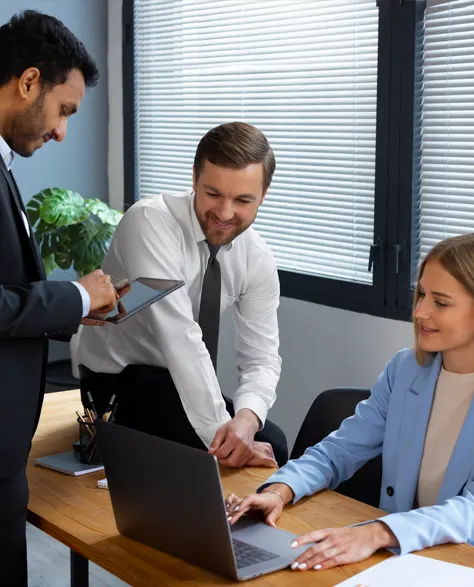 Three professional contractors in suits discussing the mudjacking process in an office setting<br />
