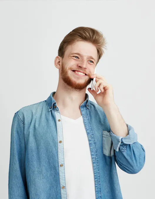 A young man talking on the phone to book his footing installation project 