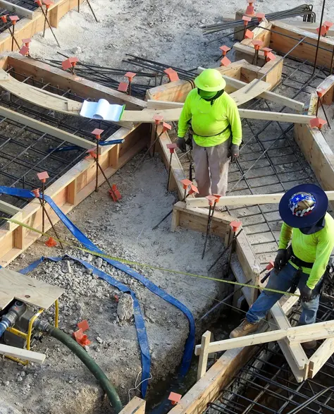 A construction team working on a foundation reinforcement project.