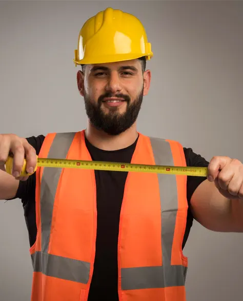 A contractor holding a measuring tape.