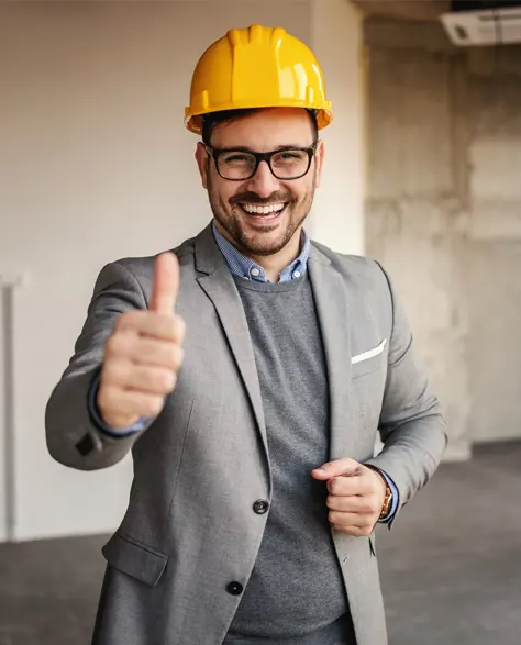 A happy construction team giving a thumbs up.