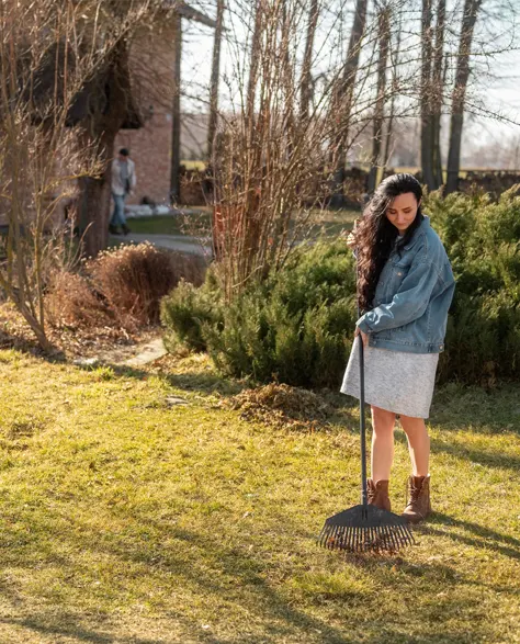 A homeowner working in her nearly repaired yard