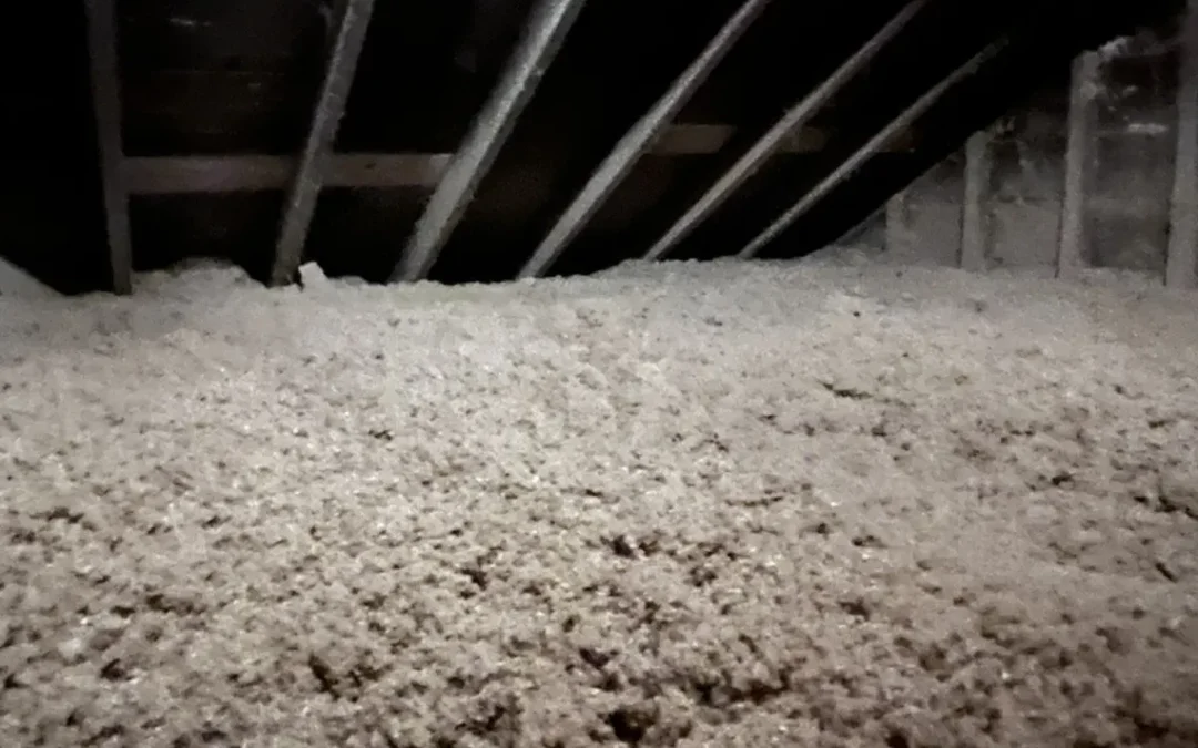 A newly installed blown cellulose insulation in the attic of a house in Queens, NY