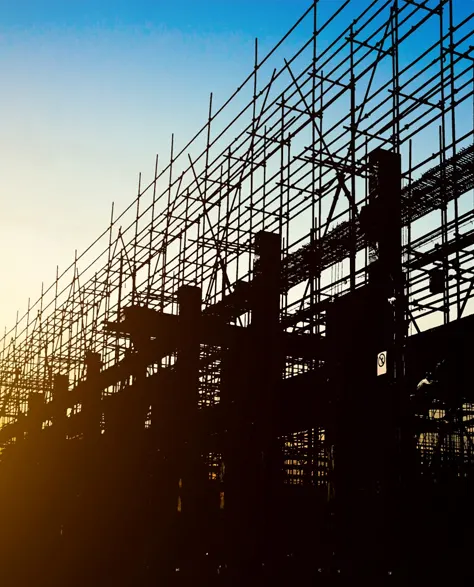 A silhouette of a building under construction