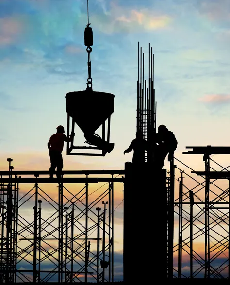 A silhouette of a construction site 