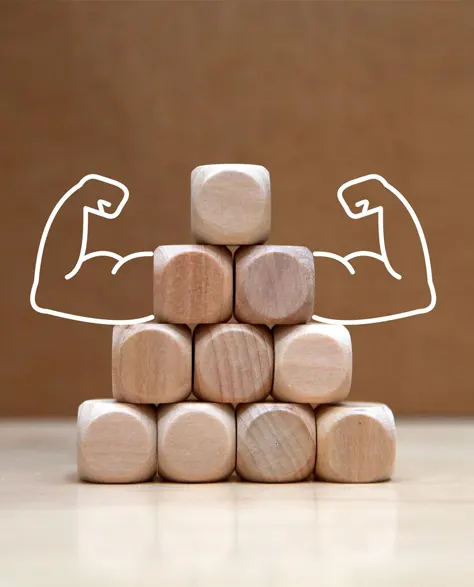 A stack of blocks with made up muscles to depict strength