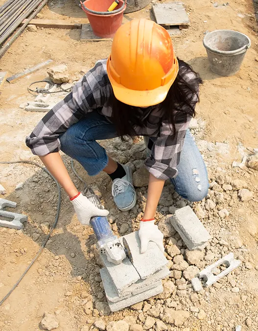 Concrete Foundation Repair: A worker working on repairing a concrete foundation in New York<br />
