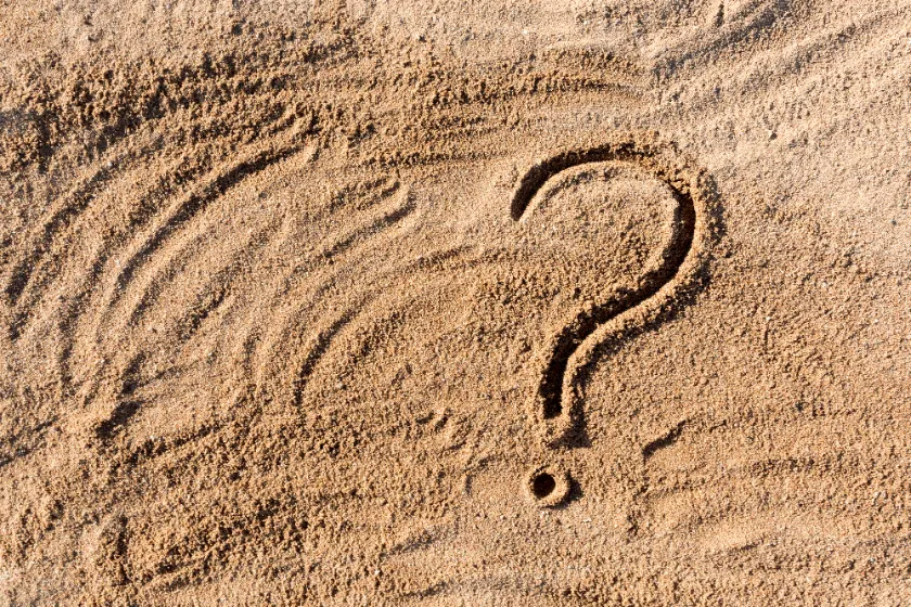 How Much Foundation Settlement Is Normal - A Picture of a Question Mark Drawn in the Sand