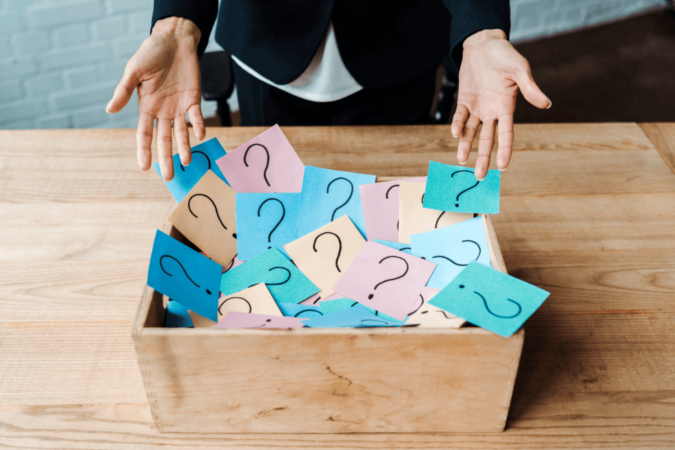 Uniform and Differential Settlement: A Woman Holding Her Hands Over a Box with Question Marks in It