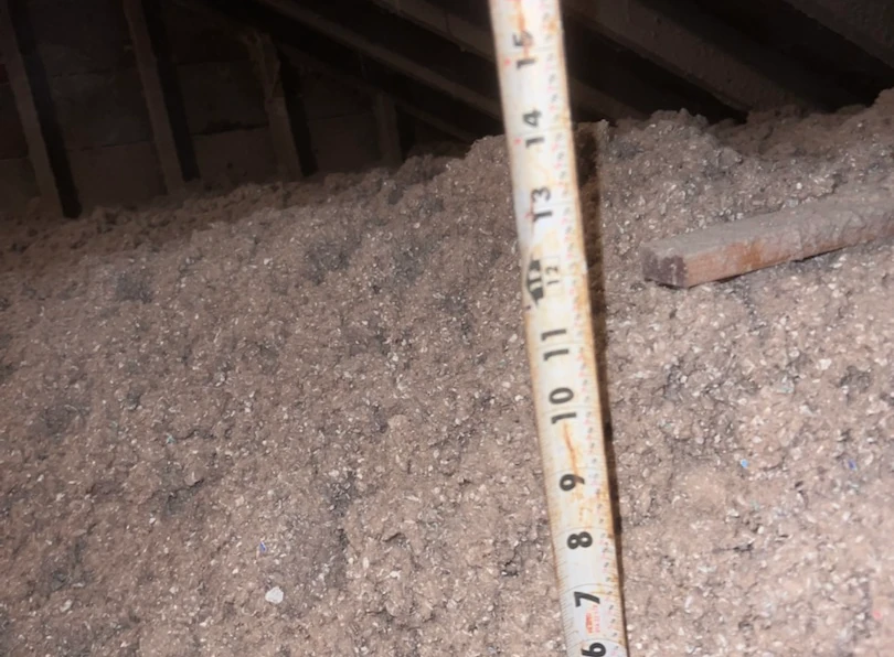 When Can You Use Blown-In Insulation in a Crawl Space - A Blown-in Installation in Queens, NY, Being Measured for Depth