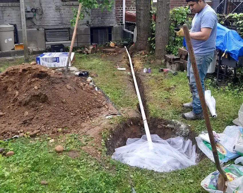 Exterior french drain installation in progress