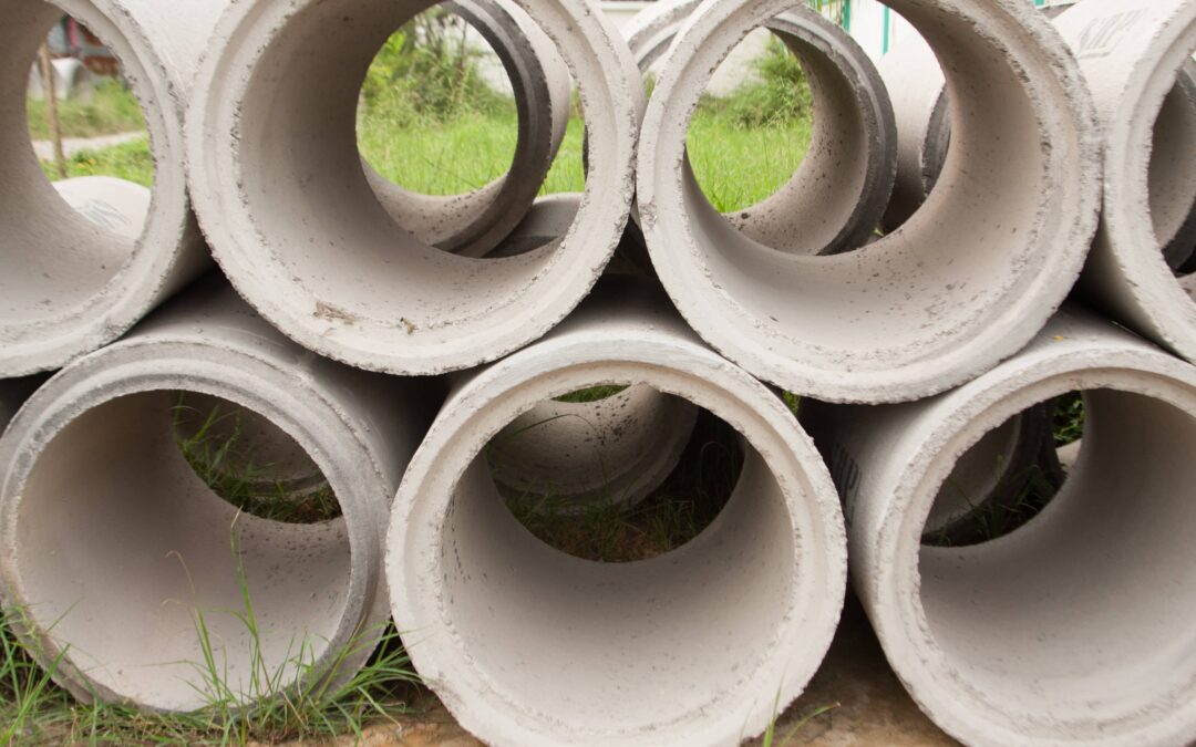 Reinforced concrete pipes stacked on top of each other.