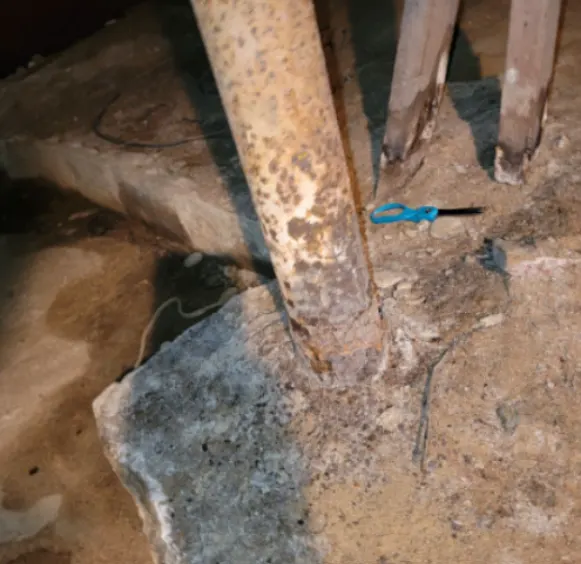 A rusted lally column
