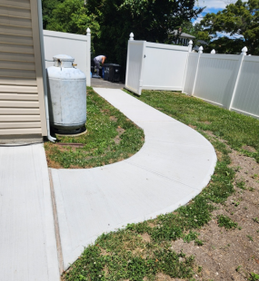 Concrete pavement with cracks and water seepage issues.