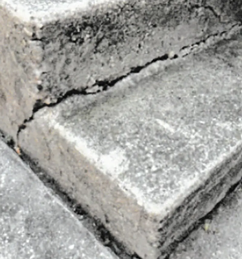 Concrete step in need of restoration in a property in Floral Park, NY