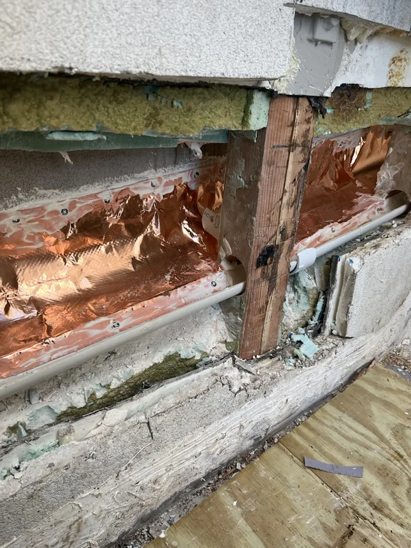 The wall where the water damage was taking place because of leakage.
