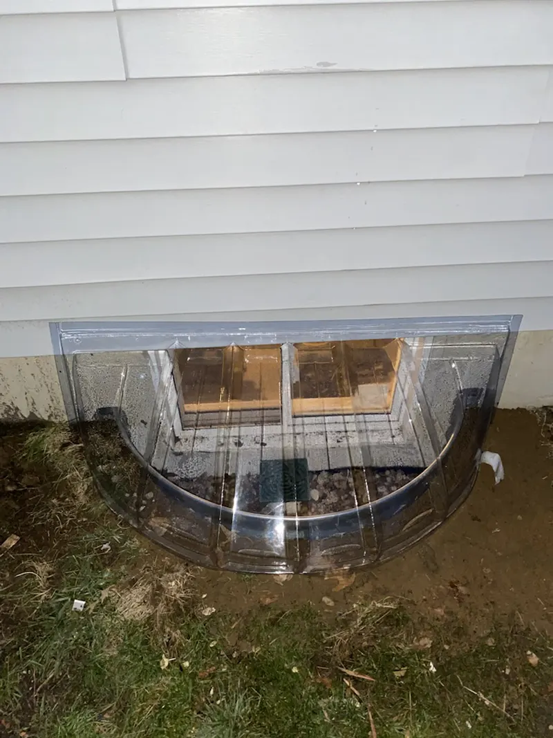 Window well installation in the basement. 