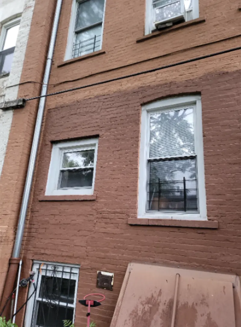 The back wall of the property which needed structural wall repair and window installation in Brooklyn, NY