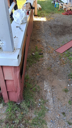 Carport with structural damage and water intrusion issues as can be seen from the pictures.