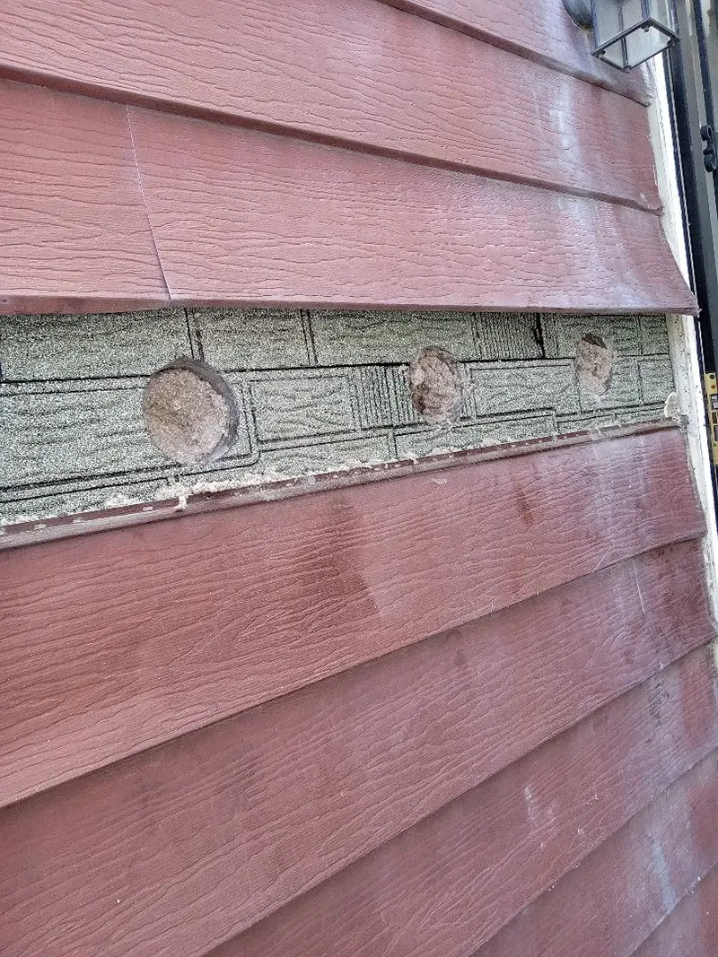 Insulation installation in progress in the exterior wall